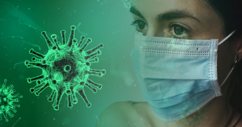 COVID-19 virus and woman wearing a face mask