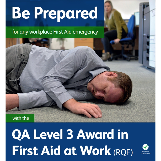First Aid at Work - Male lying on the floor with a concerned female looking on