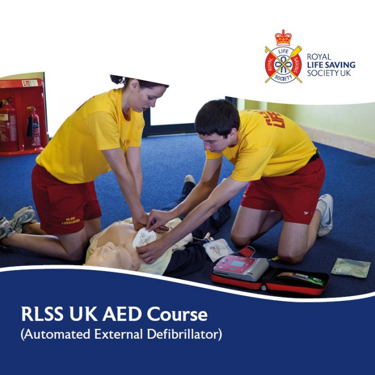 RLSS UK AED Course - Two lifeguards practising CPR and use of an AED on a manikin